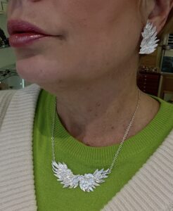 P Collana e orecchini in argento a forma di ali